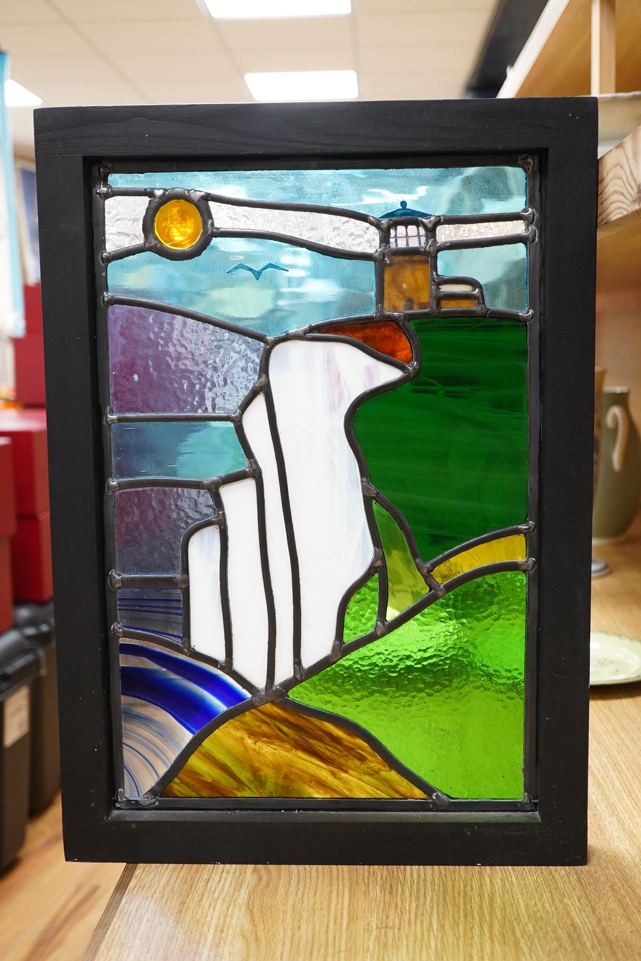 A contemporary leaded stained glass panel, Beachy Head lighthouse, framed, 51cm high overall